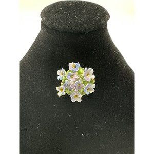 Vintage flowered brooch with purple blue flowers on green stems made in England